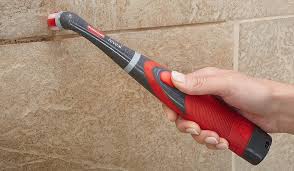 clean shower wall mold with electric brush .